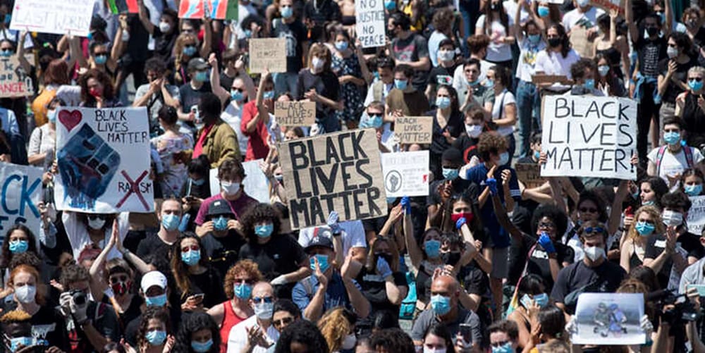Photo of crowd with Black Lives Matter signs